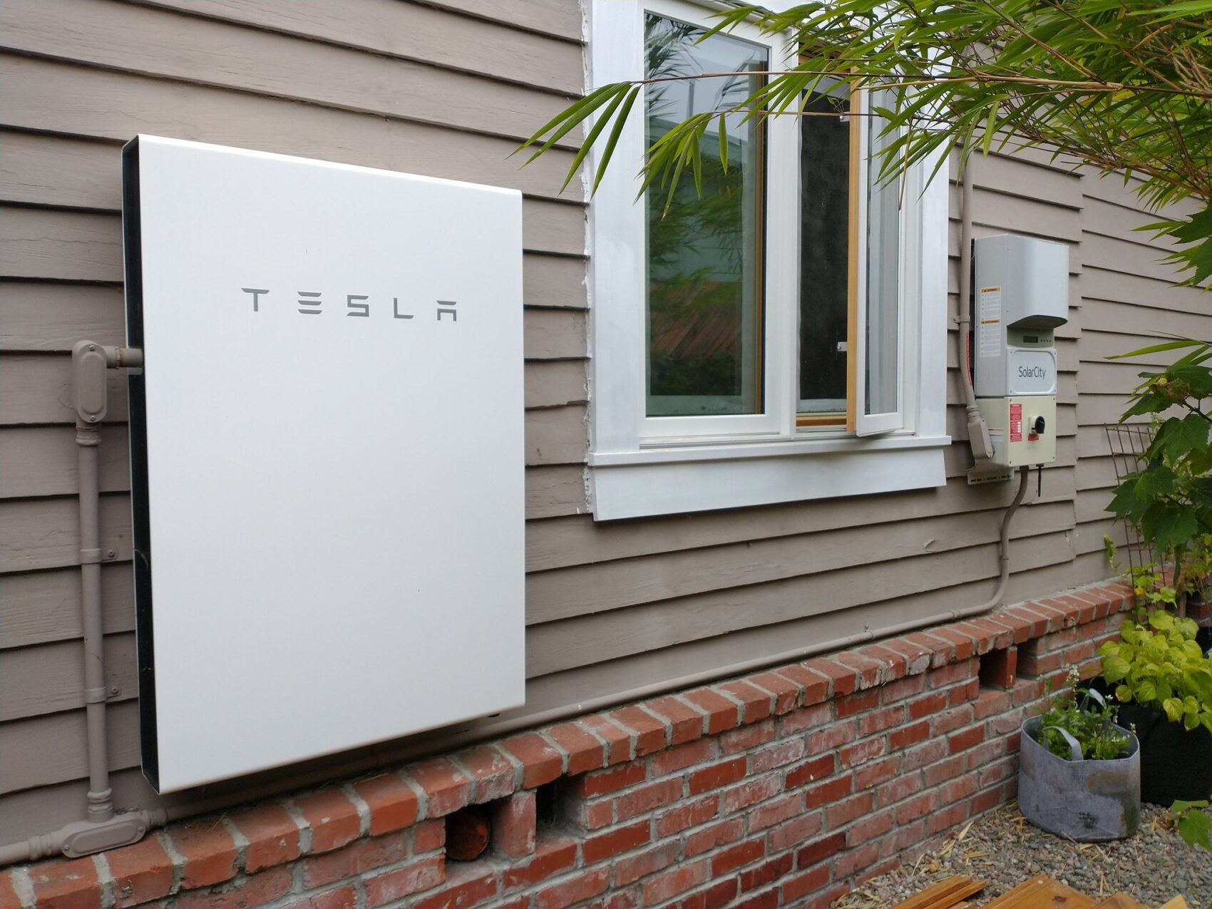 Tesla Power Wall On The Side Of A House