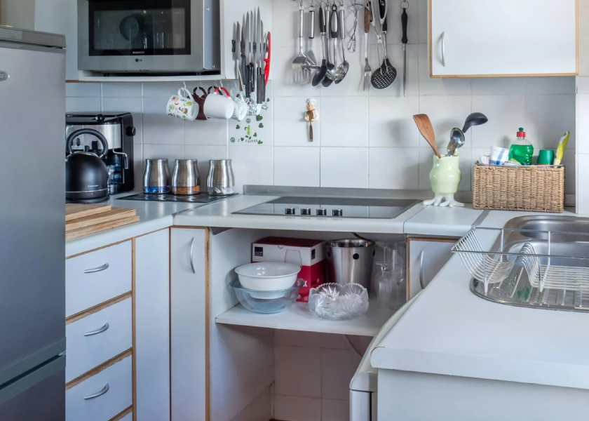 kitchen with modern stove and refrigerator