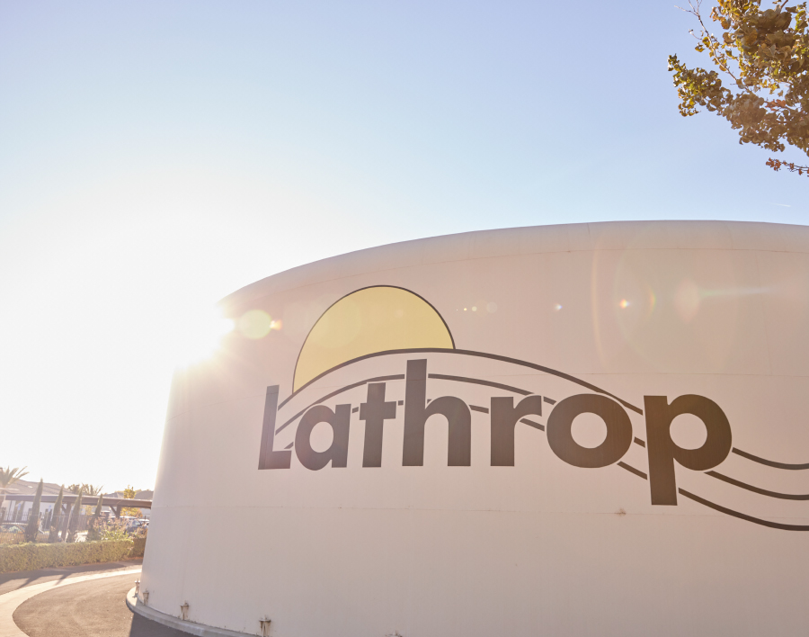 A Water Tank With The Lathrop City Logo Printed On Its Side