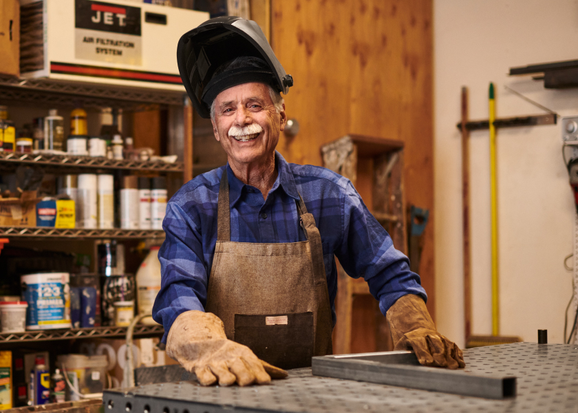 Man smiling in home workshop