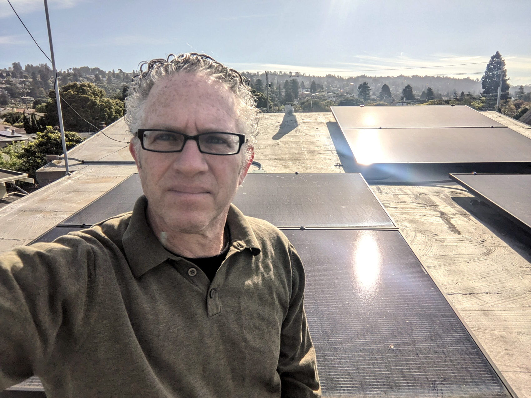 Dan Lieberman, Ava's Director Of Marketing, Stands With His Solar Panels