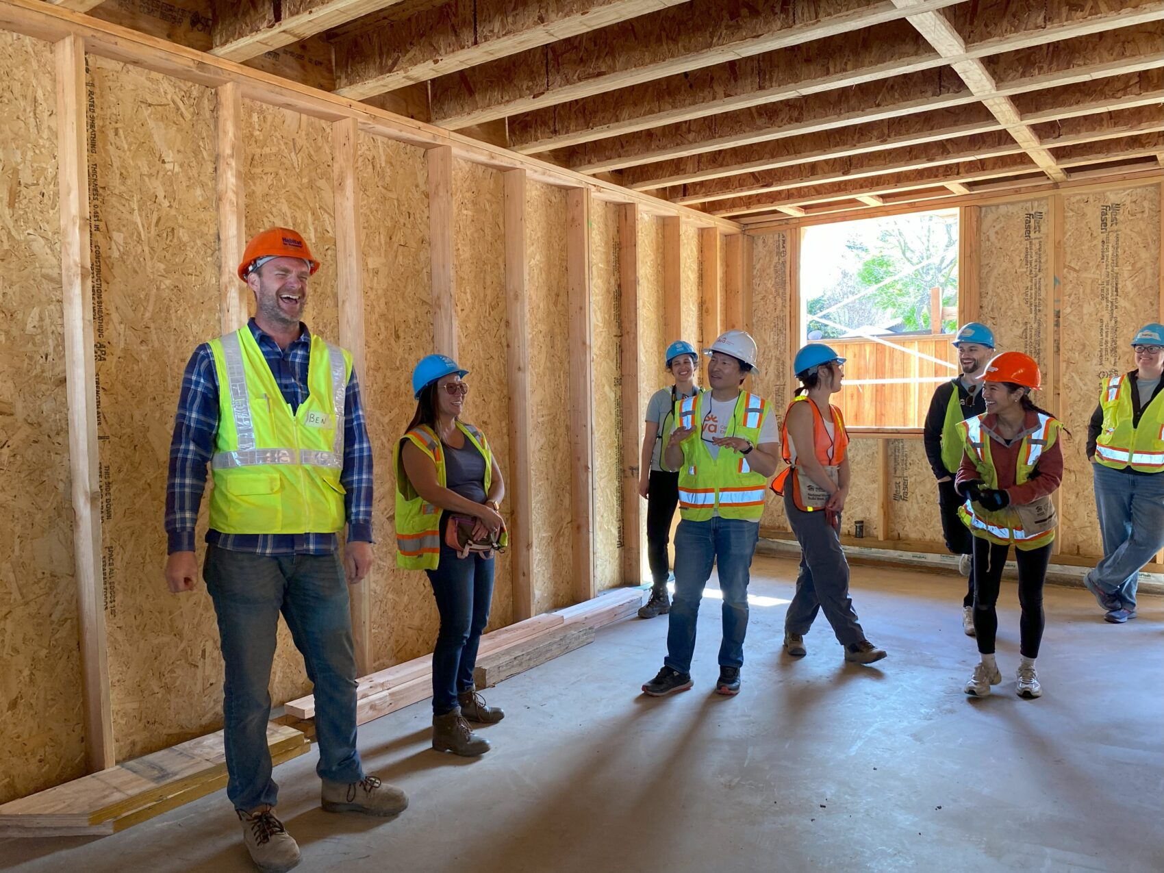 Habitat Ebsv Construction Manager Ben Grubb And Communications Manager Patti Wang Cross Share A Laugh With Ava Staff And Board Members On The Site Tour