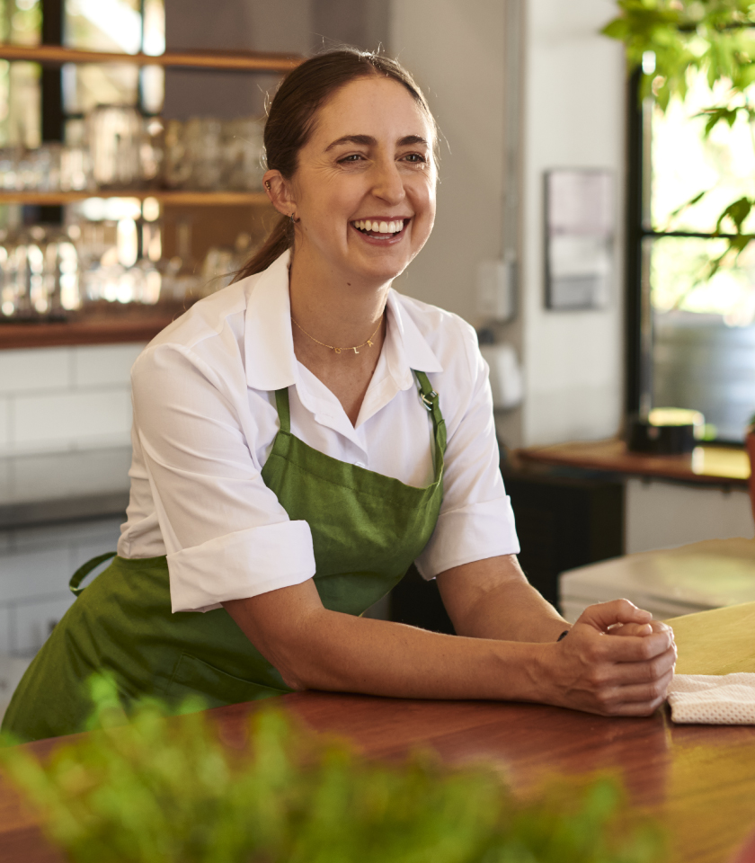 Woman standing behind service counter
