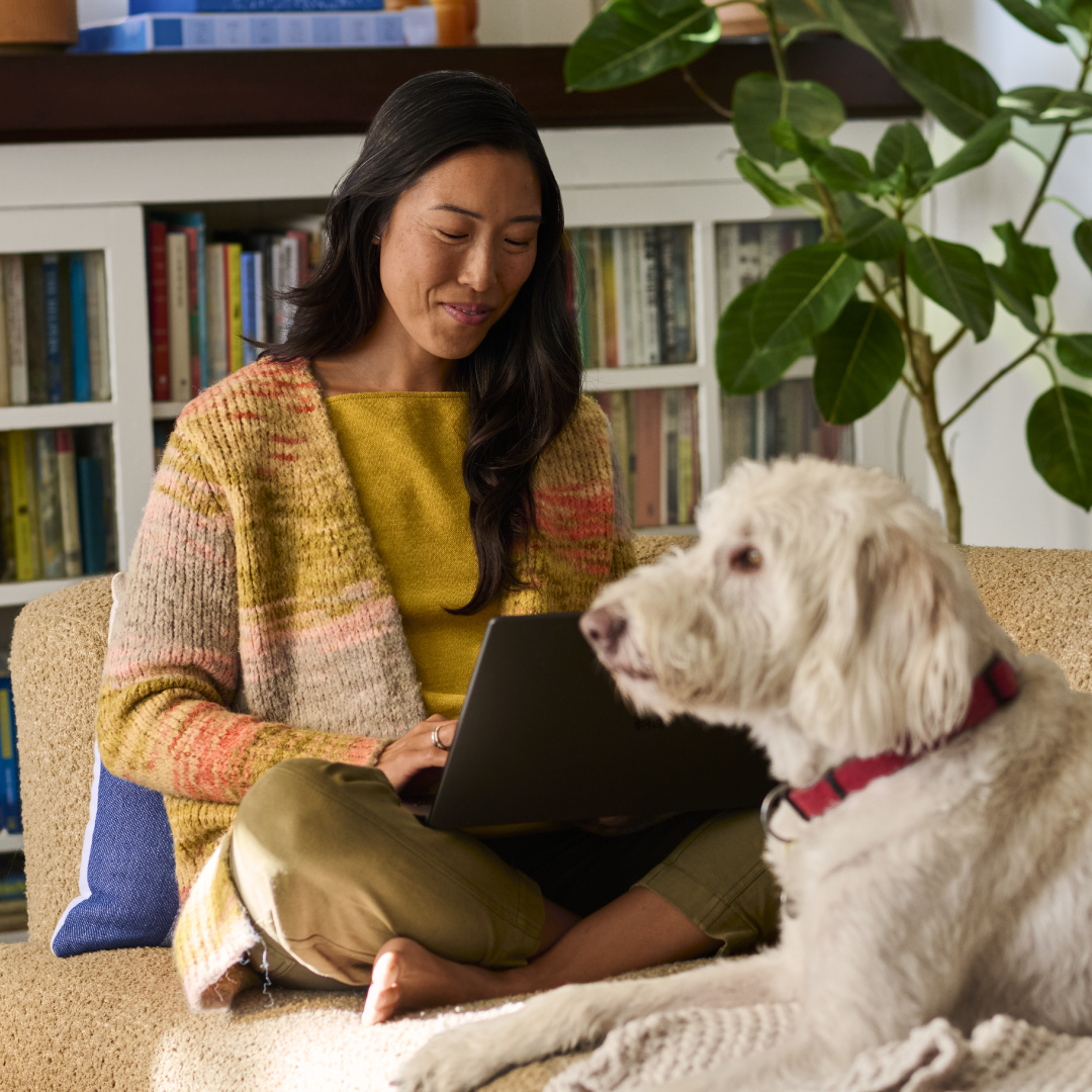 Woman At Home With Dog