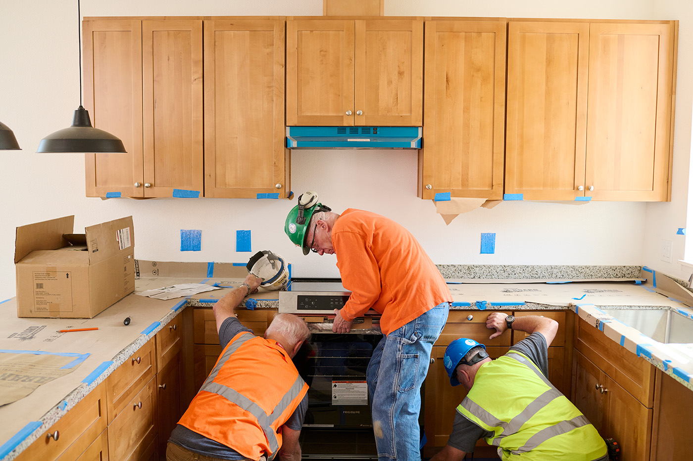 An Induction Range Being Installed At Sequoia Grove
