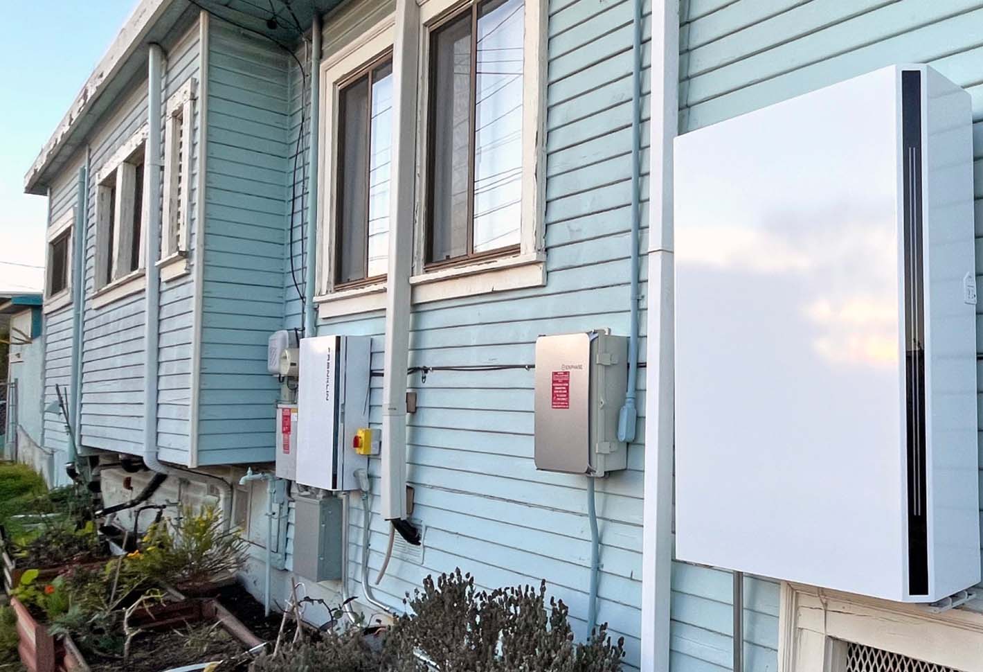 Solar-connected battery system installed on exterior of house